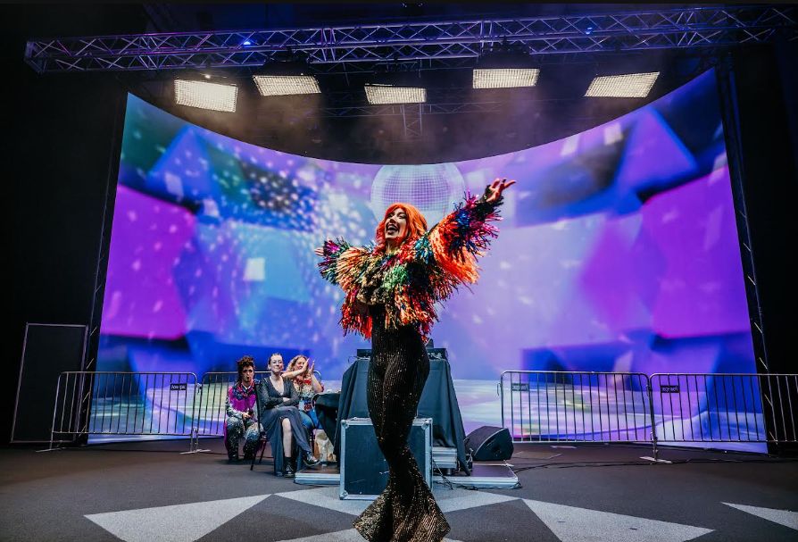 Wellington Pride Festival's Youth Ball is among the community images connected with the 2026 GiveOUT Day campaign.